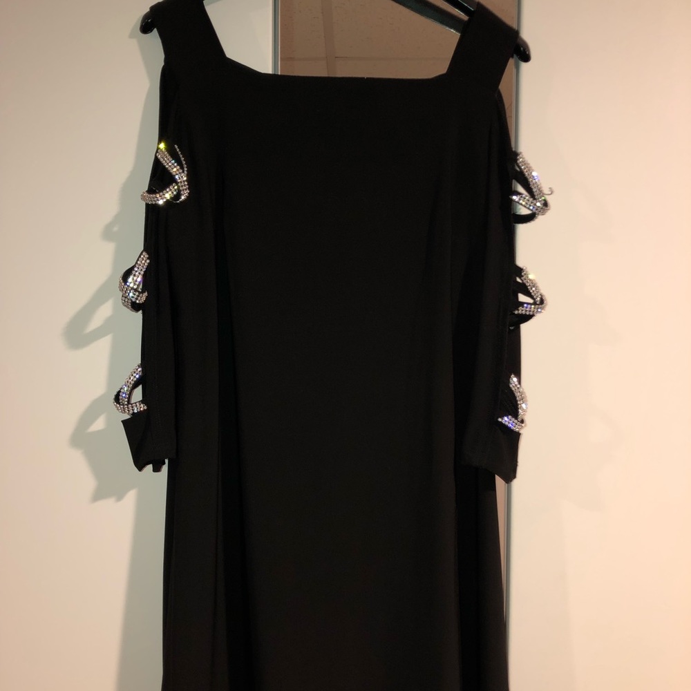 Black dress with cutouts at the sleeves